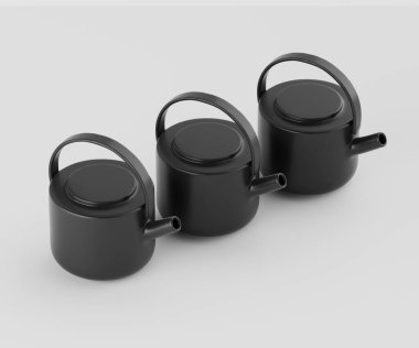 Üç küçük, modern çaydanlık parlak, nötr bir arkaplana karşı yatay sırada dizilir. Çaydanlıkların yuvarlak, kare şeklinde ve basit, kıvrımlı sapları olan tutarlı bir dizaynı var. Renkleri koyu siyahtır, bu da etkin bir şekilde tezat oluşturur. 