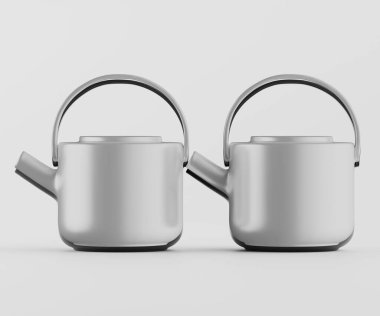 Tarafsız bir arkaplanda iki modern çaydanlık bir stüdyo ortamında sergileniyor. Çaydanlıklar açık gri renktedir, pürüzsüz ve parlak bir sona sahiptir ve simetrik bir düzende sunulurlar. Tasarım, yuvarlak şekilli ve basit elli minimalist.