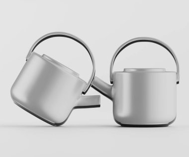 Tarafsız bir arkaplanda iki modern çaydanlık sunuluyor. Çaydanlıklar açık gri, pürüzsüz yüzeyleri ve basit yuvarlak şekilleri var. Hafifçe açılı konumlanmışlar, dinamik bir görüntü yaratıyorlar. Aydınlatma bile gösterişli.