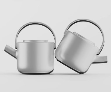 İki modern çaydanlık, açık gri renkli, bir stüdyo ortamında sunuluyor. Tencereler parlak ve basit, temiz çizgileri var. Işıklandırma eşit ve nötr, çaydanlıkların pürüzsüz yüzeylerini ve biçimlerini vurguluyor. Tencereler yerleştirildi.