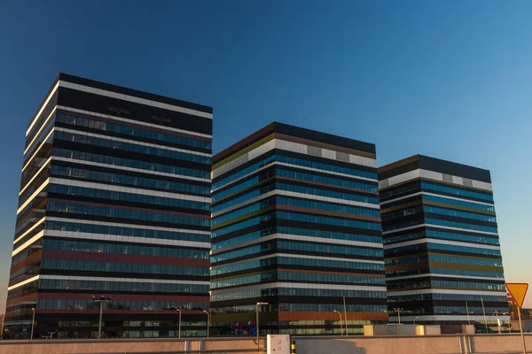 stock image Modern office buildings in the evening. Skyscraper exterior.