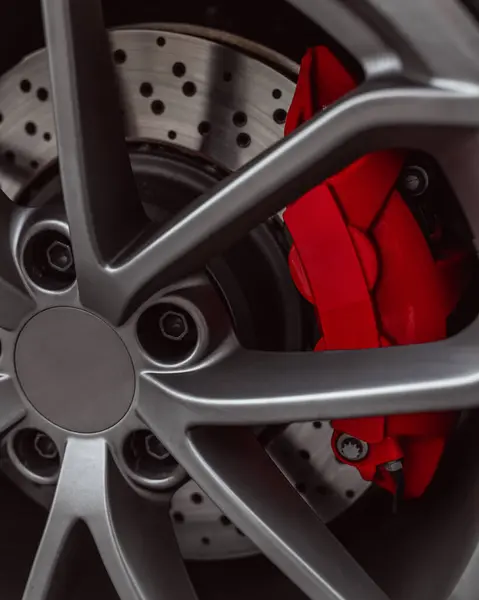 Close Sports Car Alloy Wheel Metal Brake Disc Red Caliper Stock Image