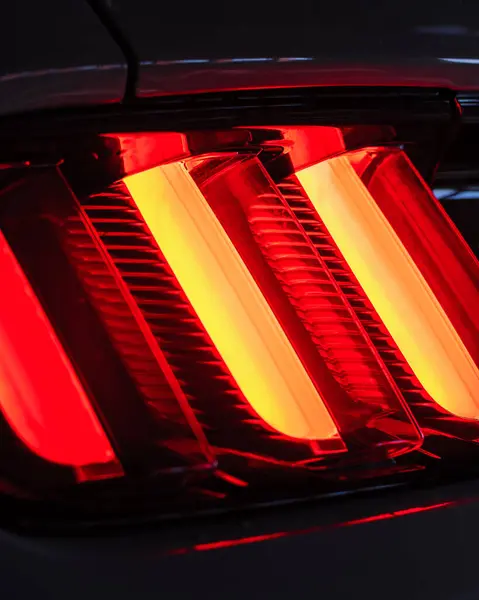 Red LED taillight of a modern sports car, close up photo of vehicle details