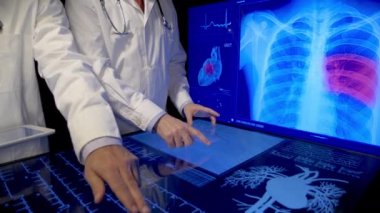 Cardiologists doctors looking at medical data