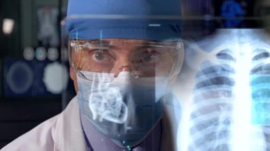 Doctor looking X-ray on tablet screen 