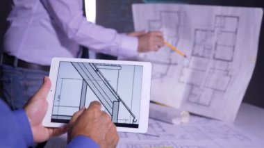 Civil engineers working on blueprints