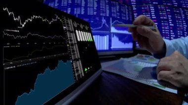 Trader working online in office
