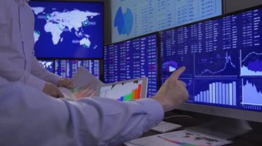 Traders looking data on screen