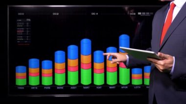 Trader looking sales data on screen