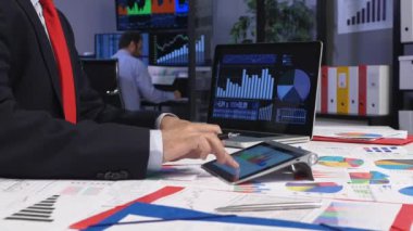 Trader Working In Office And Looking data on Screen 