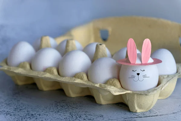 funny egg with bunny ears in tray