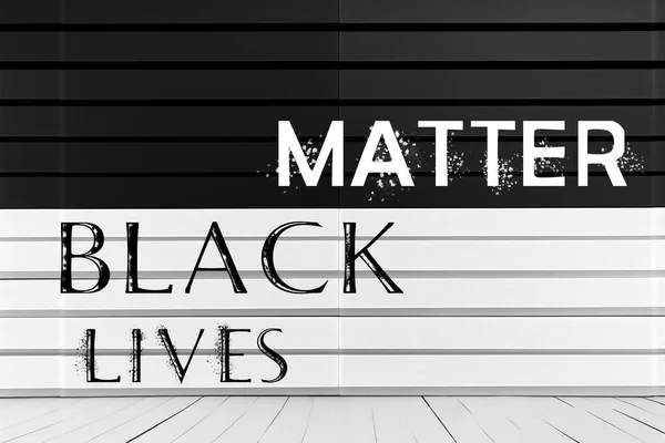 BLACK LIVES MATTER text on a black and white background. Concept of Human rights. Protest against the end of racism.