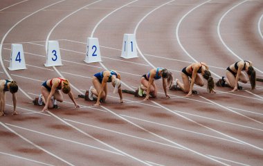 Chelyabinsk, Russia - June 23, 2022: race female athletes runners start at 100 meters clipart