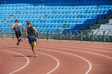 Chelyabinsk, Russia - June 23, 2022: athletes runners running 400 meters race