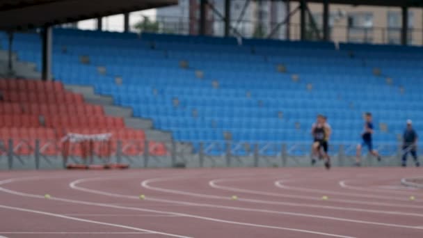 Male Athletes Running 800 Meters Race — Stockvideo