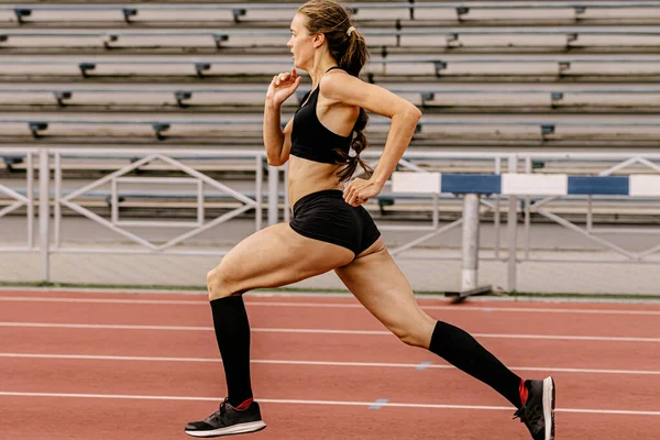 female athlete running in compression socks