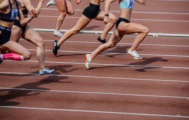 Chelyabinsk, Russia - June 4, 2022: group female athlete running sprint race in spikes shoes Nike during UFD Athletics Championship