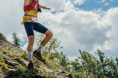 male runner balancing on running down steep mountainside, summer trail marathon race clipart