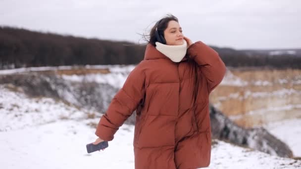 Young Attractive Woman Winter Clothes Wearing Headphones Listening Music Dancing — Stock Video
