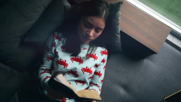 Young Woman Reads Bible Lying Sofa Home Closes Book Has — Vídeos de Stock