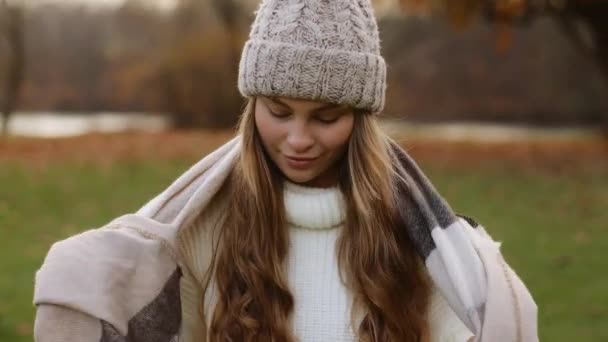 Young Lady Pretty Woman Warm Sweater Hat Wraps Herself Scarf — Video