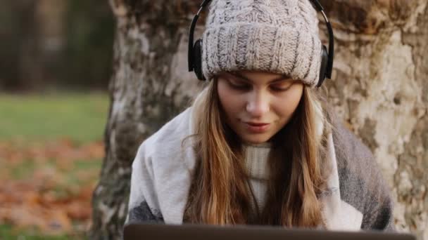 Young Focused Female Student Freelancer Sitting Autumn Park Tree Working — Video Stock