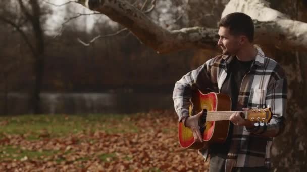Young Man Shirt Guitar Stands Lawn Autumn Forest Park Boy — Vídeo de Stock