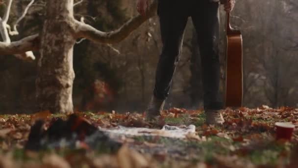 Young Man Boy Traveler Approaches Fire Meadow Autumn Forest Sits — Vídeo de Stock