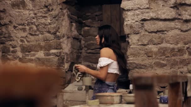 Young Attractive Long Haired Female Potter Wipes Her Hands Towel — Vídeo de stock