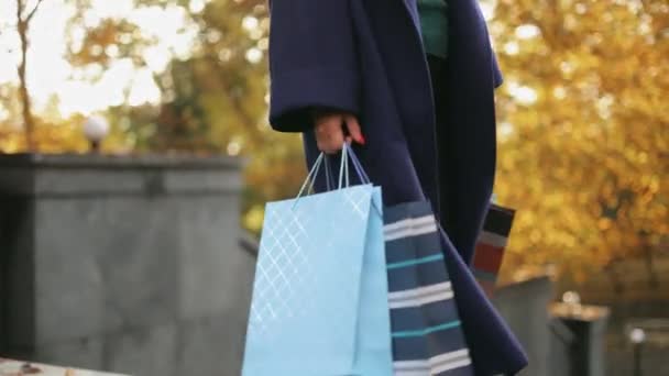 Woman Legs Jeans Sneakers Stylish Coat Walks Shopping Bags Slow — Stock Video
