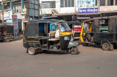 Gandhidham, Gujarat, India - 12 02 2022: Rikishas or tuk-tuk parked on the street and waiting for passengers.