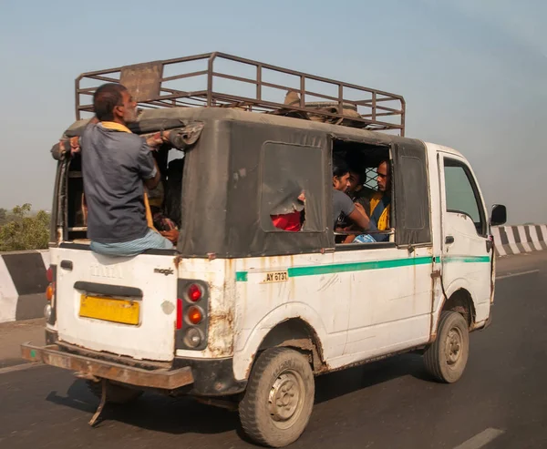 Morbi, Gujarat, India - 12 02 2022: A fully loaded car carrying passengers on the road from an Indian city.