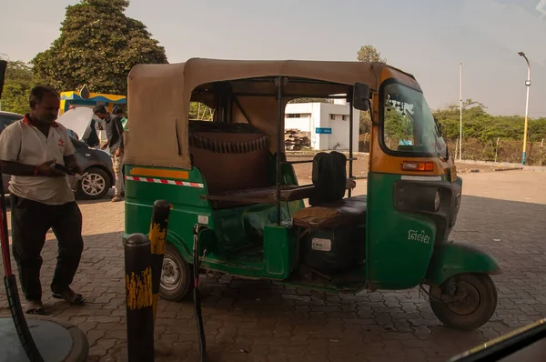 Morbi, Gujarat, India - 12 02 2022: Auto rickshaw at a Petrol Station. The driver stayed near.