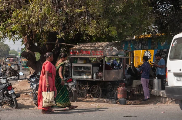 Gandhidham, Gujarat, India - 12 02 2022: Women walking on street and carring the bags in India.