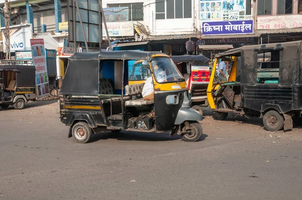 Gandhidham, Gujarat, India - 12 02 2022: Rikishas or tuk-tuk parked on the street and waiting for passengers.