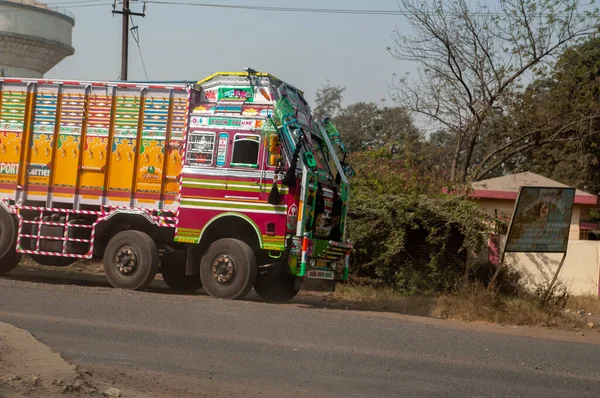 Typical, colourful, decorated truck in India. Parked on street.