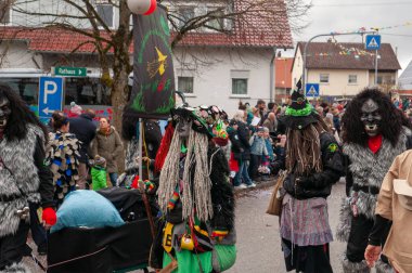 Hohenstadt - February 17, 2023: Participant of a parade with costumes and masks at the traditional carnival parade in Hohenstadt, Germany.