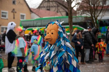 Hohenstadt - February 17, 2023: Participant of a parade with colourful costumes at the traditional carnival parade in Hohenstadt, Germany.