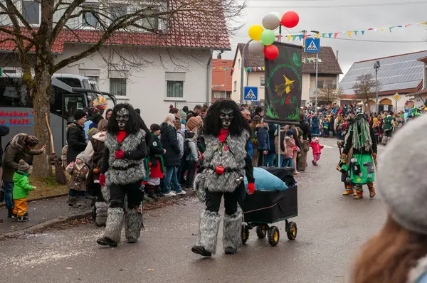 Hohenstadt - February 17, 2023: Participant of a parade with werewolf mask at the traditional carnival parade in Hohenstadt, Germany.