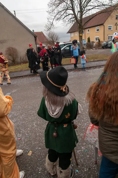 Hohenstadt - February 17, 2023: Participant of a parade with witch costume at the traditional carnival parade in Hohenstadt, Germany.