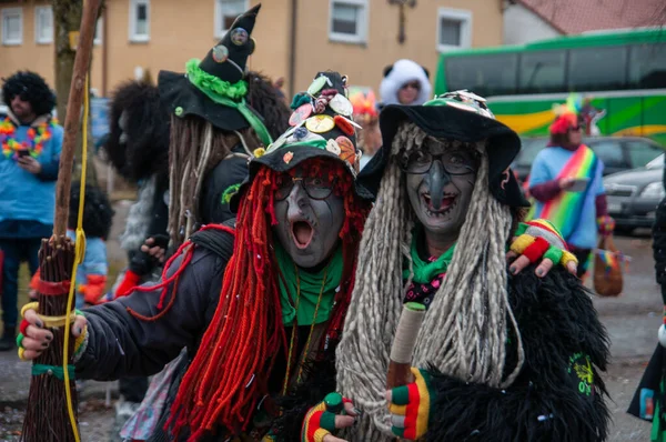 Hohenstadt - February 17, 2023: Participant of a parade with witch masks and costumes at the traditional carnival parade in Hohenstadt, Germany.