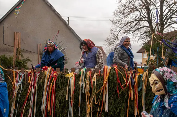 Hohenstadt - February 17, 2023: Participants of a parade with traditional costumes at the carnival parade in Hohenstadt, Germany.