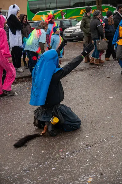 Hohenstadt - February 17, 2023: Participants of a parade with traditional costumes and masks at the carnival parade in Hohenstadt, Germany.
