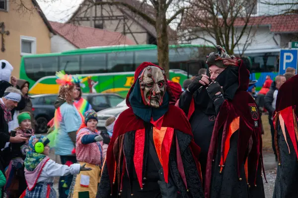 Hohenstadt - February 17, 2023: Participant of a parade with terrible mask at the traditional carnival parade in Hohenstadt, Germany.