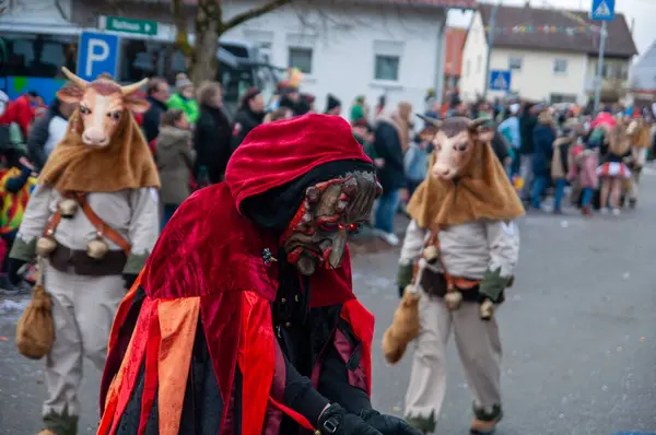 Hohenstadt - February 17, 2023: Participant of a parade with terrible mask at the traditional carnival parade in Hohenstadt, Germany.