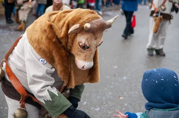 Hohenstadt - February 17, 2023: Parade participants in cow costumes and masks at the carnival parade in Hohenstadt, Germany.