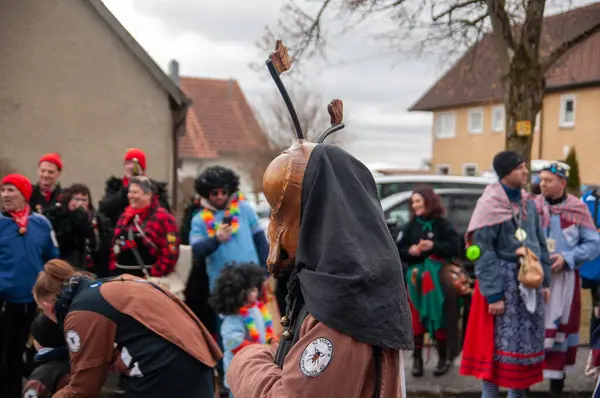 Hohenstadt - February 17, 2023: Participant of a parade in beetle masks and costumes at the traditional carnival parade in Hohenstadt, Germany.