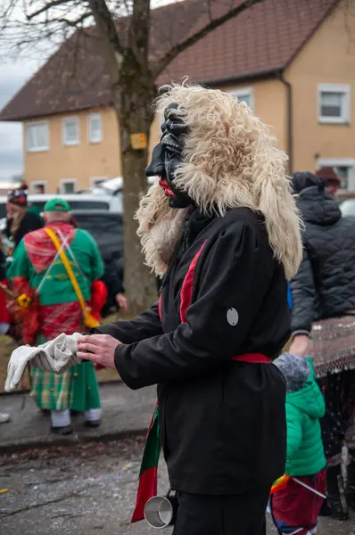 Hohenstadt - February 17, 2023: Participant of a parade in terrible mask at the traditional carnival parade in Hohenstadt, Germany.