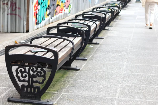 empty chair. seats in public places that are not occupied. chairs made of wood. outdoor chair. rest area. a place to relax.