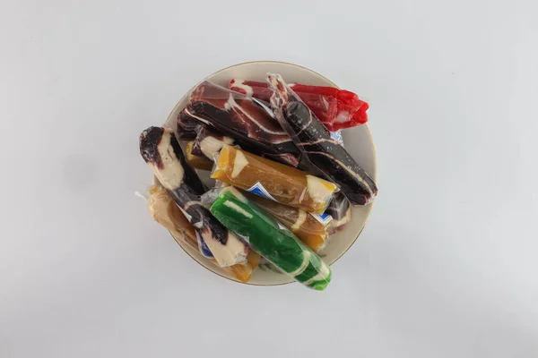 Dodol or Jenang. food by Yogyakarta typical. served on a white background plate.